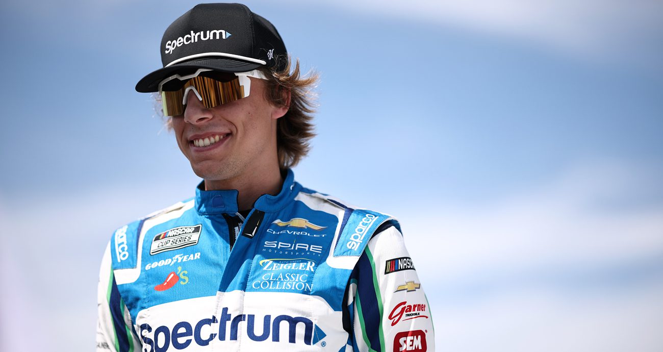 Carson Hocevar smiles while walking the grid at World Wide Technology Raceway at Gateway.