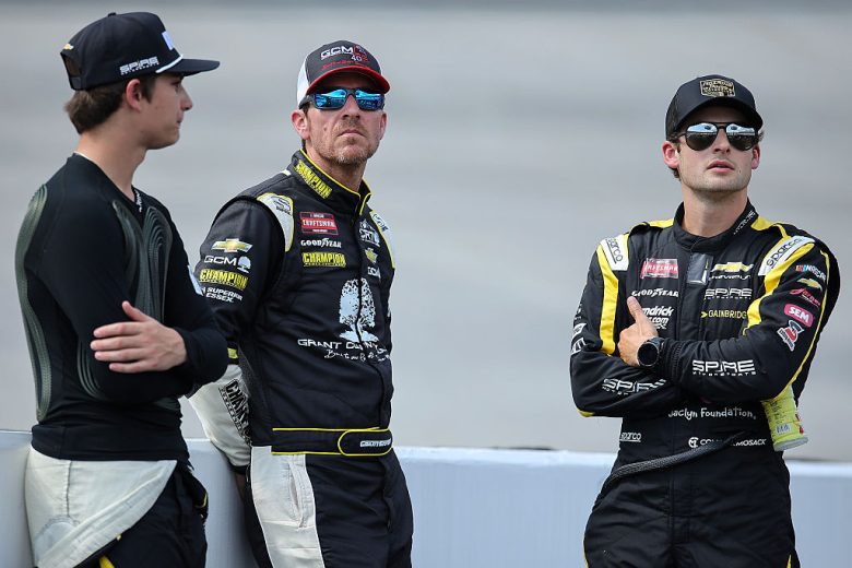 Connor Mosack, Grant Enfinger and Tristan McKee look on.