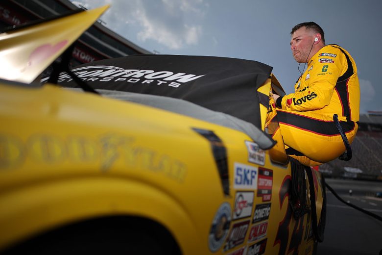 Layne Riggs enters his truck.