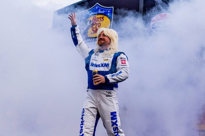 Tyler Reddick waves to fans.