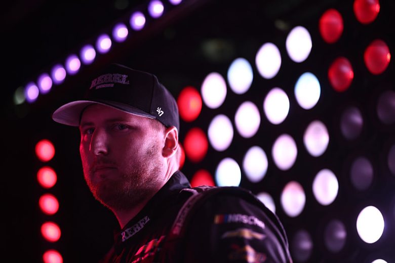 Austin Hill looks on.