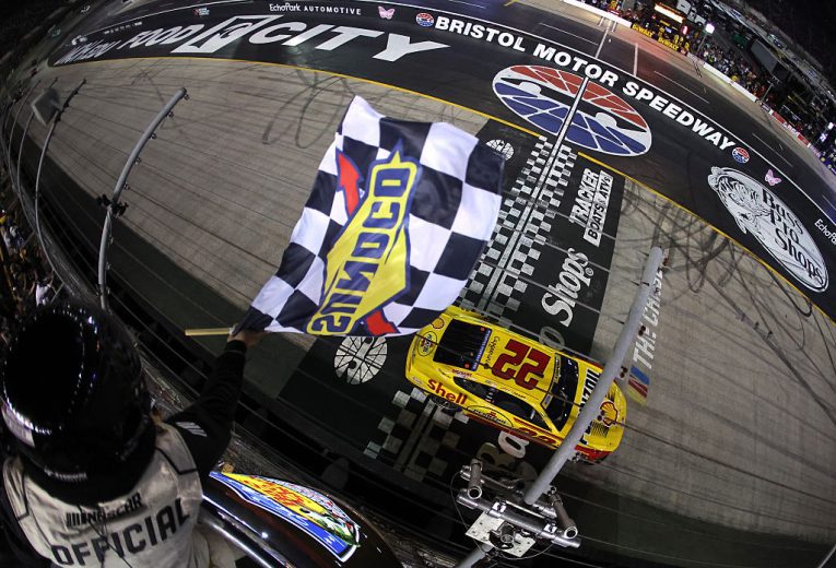 Joey Logano takes the checkered flag at Bristol.