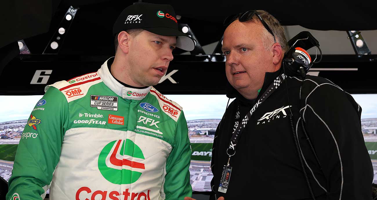 RFK Racing's Brad Keselowski, left, and crew chief Jeremy Bullins talk shop at Daytona International Speedway