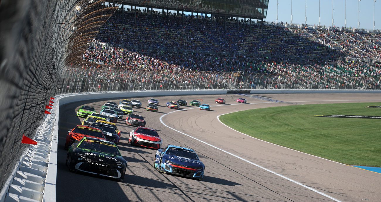 NASCAR Cup Series cars race at Kansas Speedway.