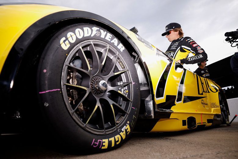 Carson Hocevar enters his car.