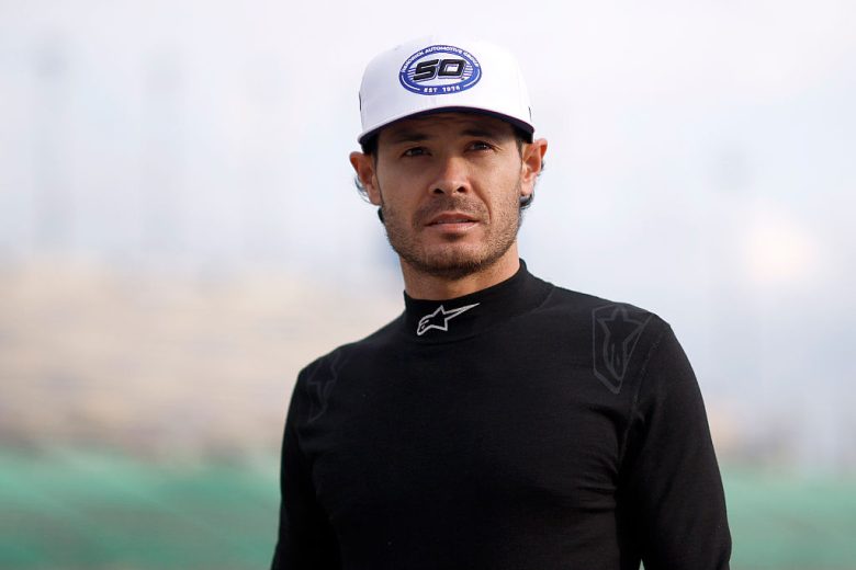 Kyle Larson looks on.