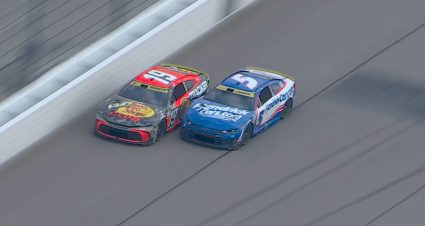 Larson charges around Briscoe to regain lead late at Kansas