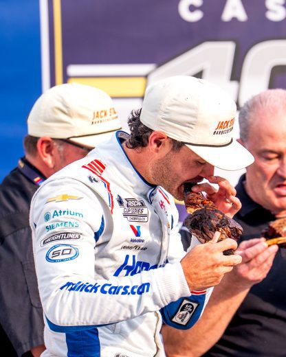 Kyle Larson eats barbecue.