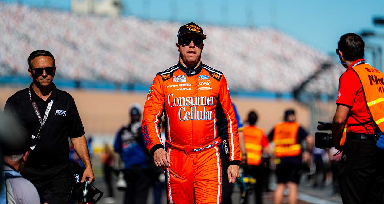 Brad Keselowski walks the Cup Series grid on pit road at Las Vegas Motor Speedway