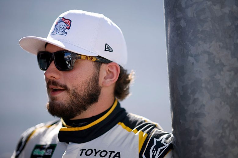 Taylor Gray looks on.