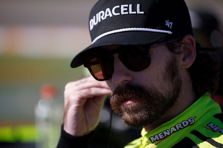 Ryan Blaney looks on.