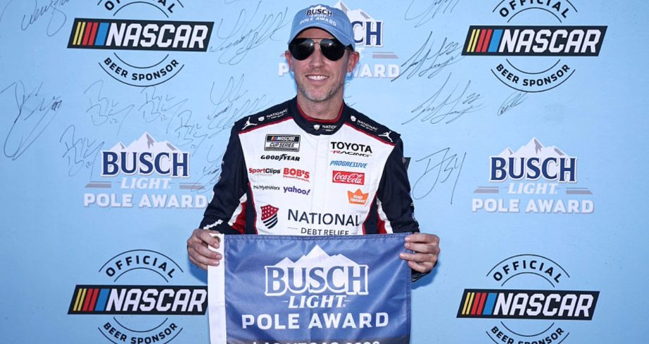 Denny Hamlin celebrates after winning the pole at Las Vegas.