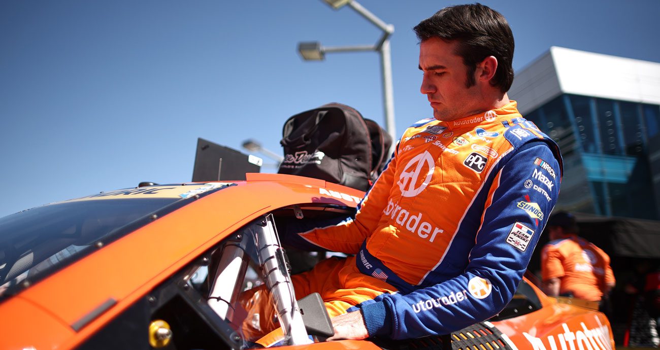 Austin Cindric climbs into his Team Penske Ford at Las Vegas.