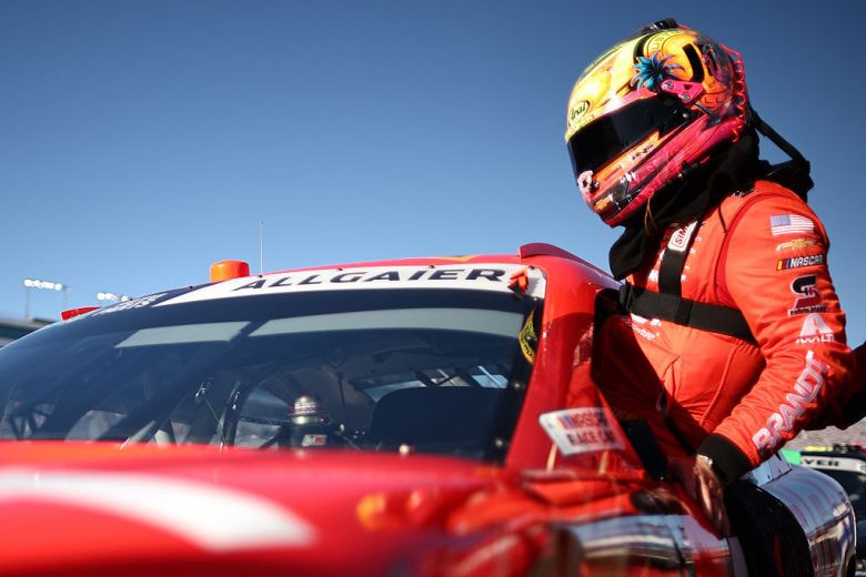 Justin Allgaier enters his car.