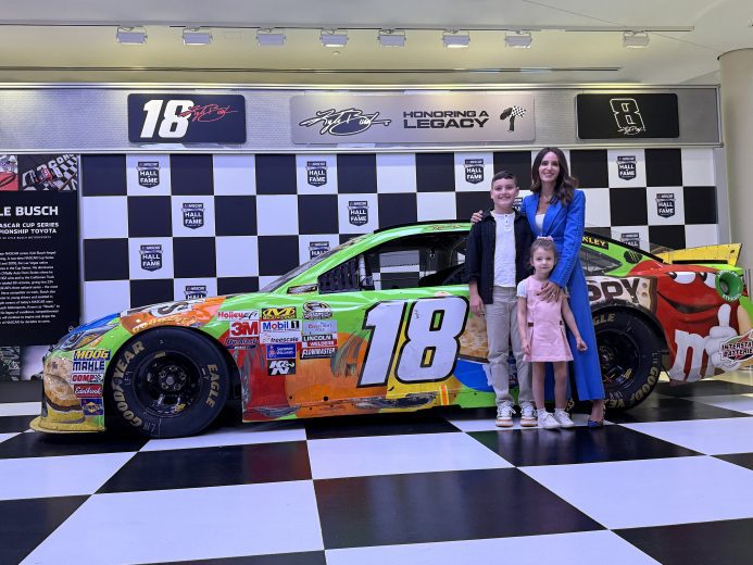 The Busch family looks on.