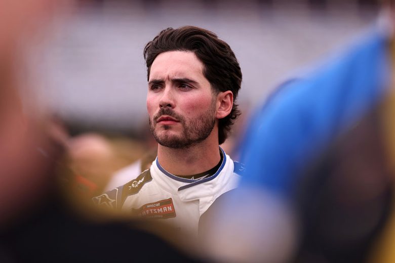 Tanner Gray looks on.