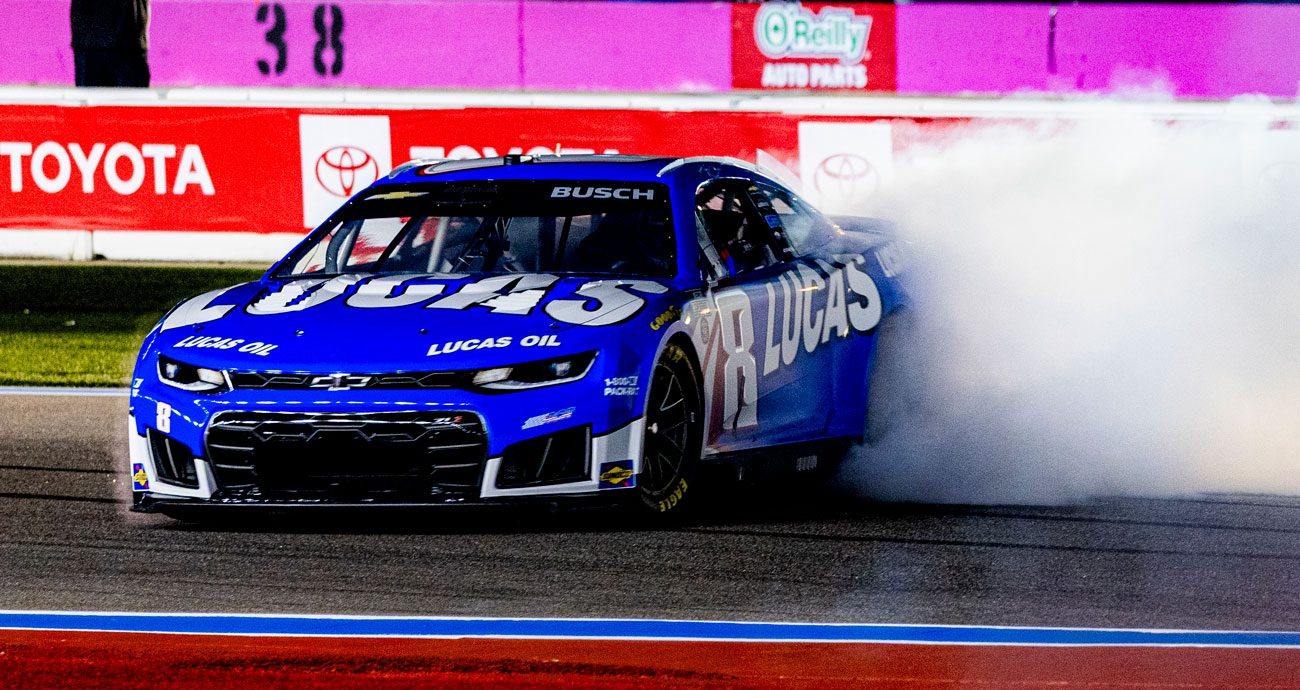 Brexton Busch performs a burnout in the car his father, Kyle Busch, drove.