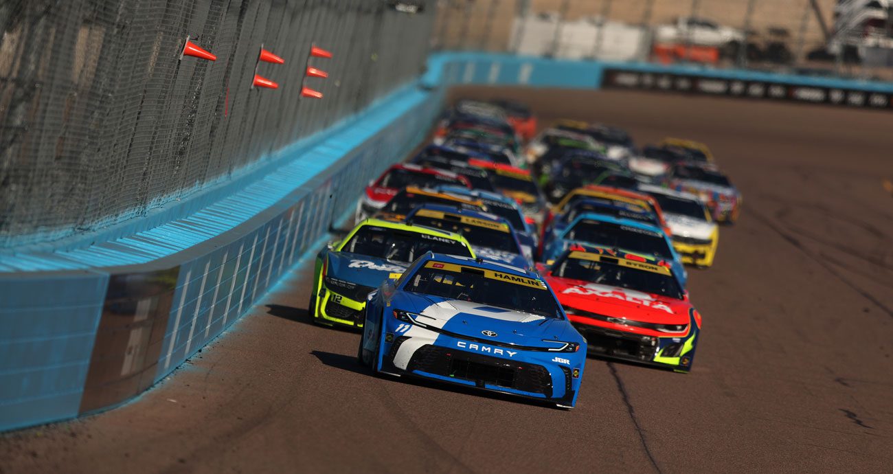 NASCAR Cup Series cars race at Phoenix Raceway.