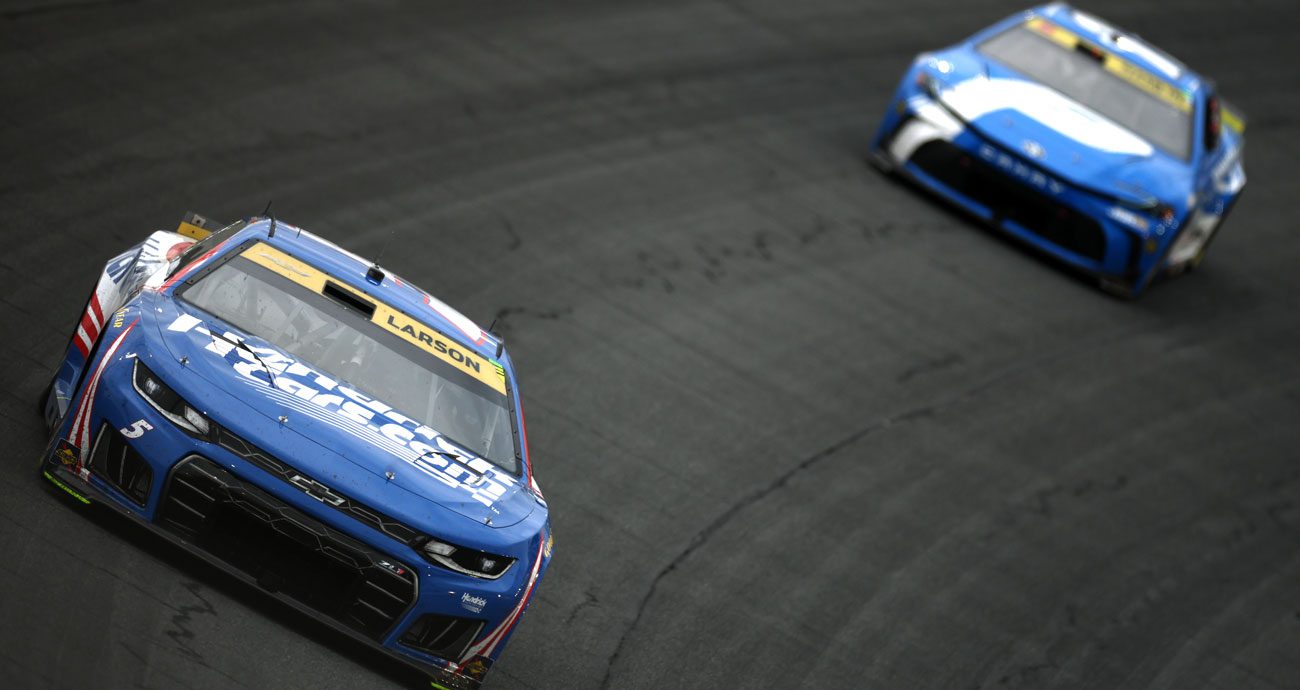 Kyle Larson and Denny Hamlin race at Charlotte.