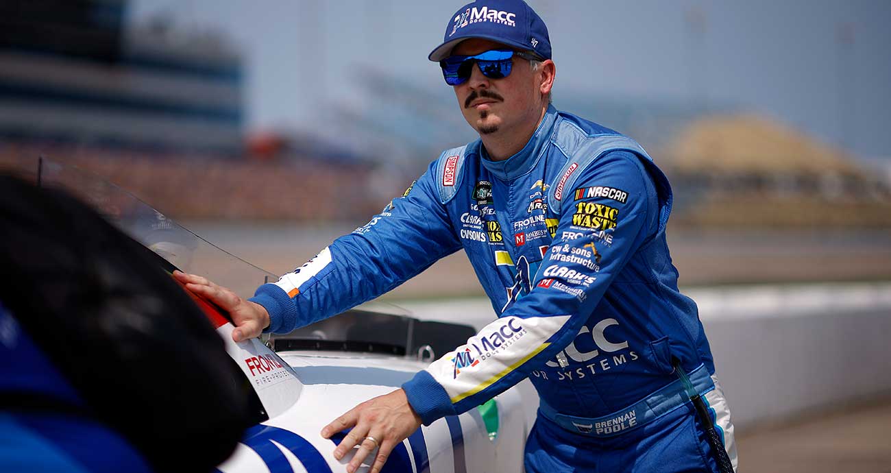 Brennan Poole pushes his car to the grid at Iowa Speedway