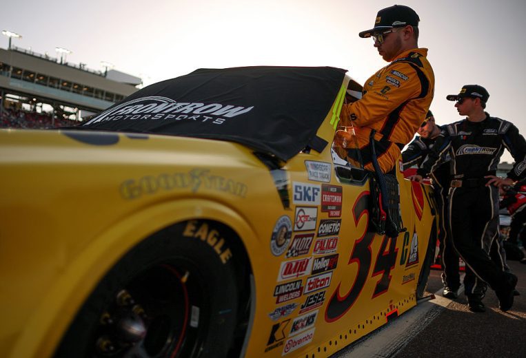 Layne Riggs enters his truck.