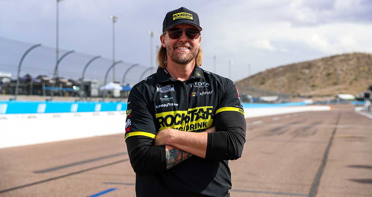 No. 45 fueler Brian Dheel stands outside of the team's pit box at Phoenix Raceway
