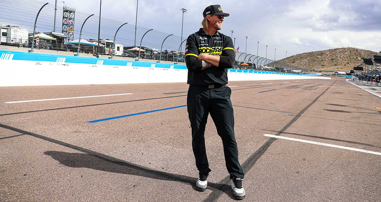 No. 45 fueler Brian Dheel stands outside of the team's pit box at Phoenix Raceway