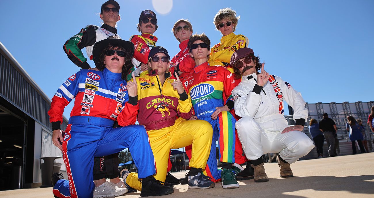 Fans pose for a photo at Talladega Superspeedway.