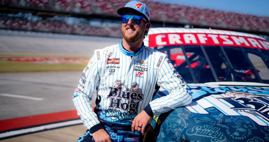 Cleetus McFarland poses with his truck at Talladega.