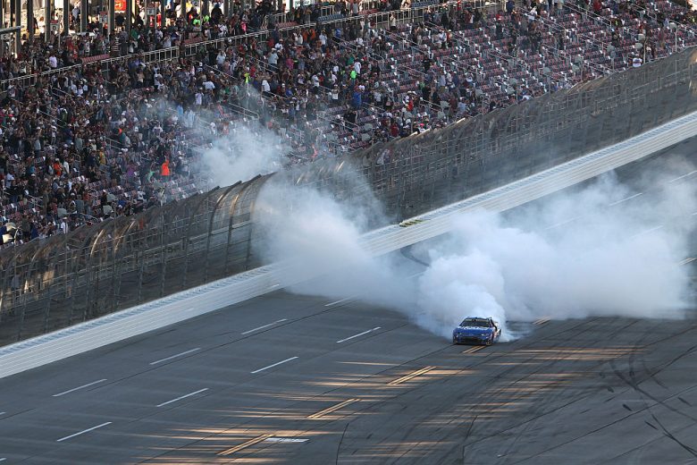 Kyle Larson does a celebratory burnout.