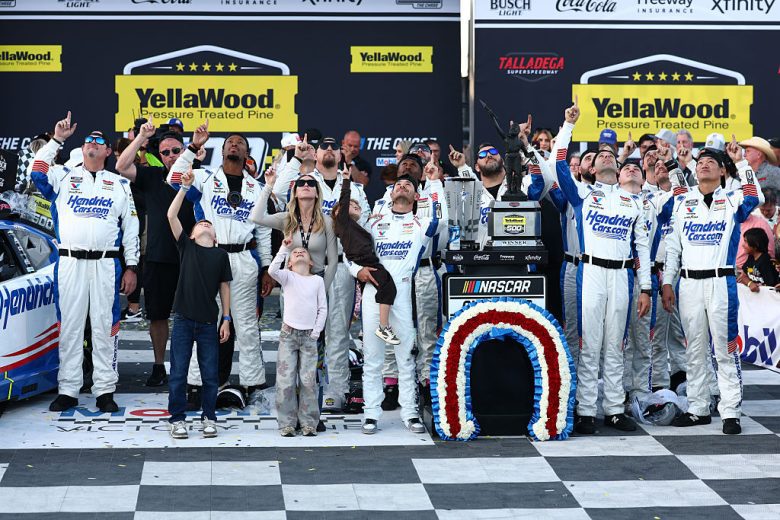 Kyle Larson and his team pose for a photo.