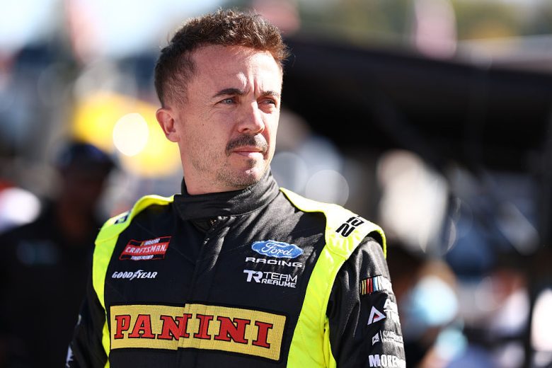 Frankie Muniz looks on.