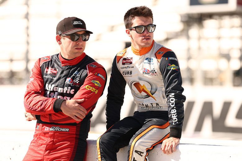 Cole Butcher and Jake Garcia look on.